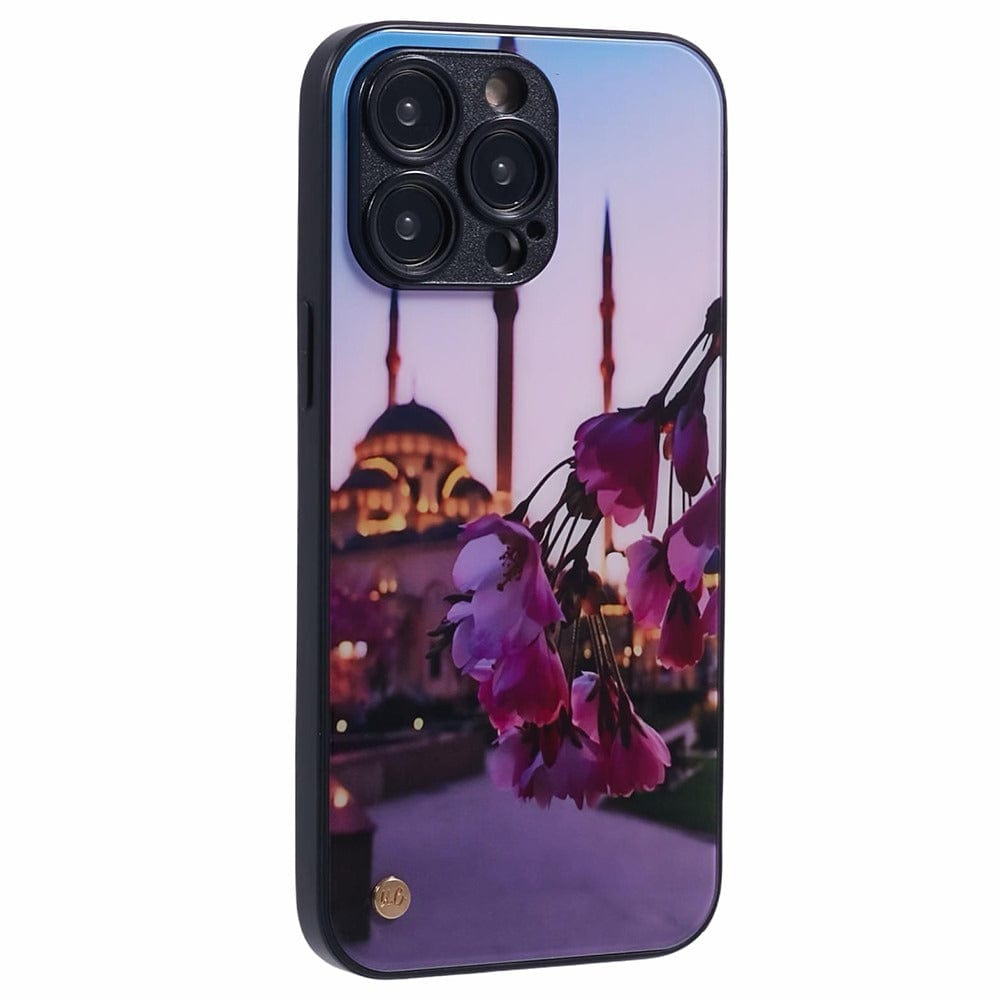 A smartphone case with a design featuring rose petals in the foreground and a mosque with multiple minarets in the background, set against a twilight sky.