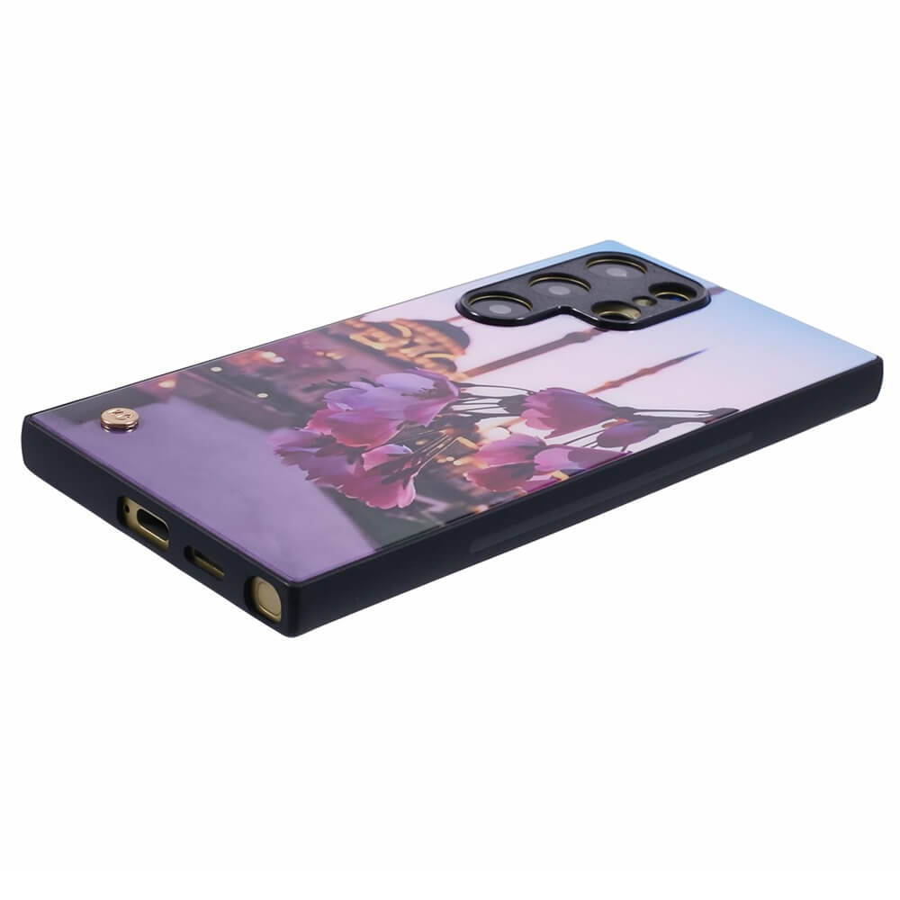 A smartphone case with a design featuring rose petals in the foreground and a mosque with multiple minarets in the background, set against a twilight sky.