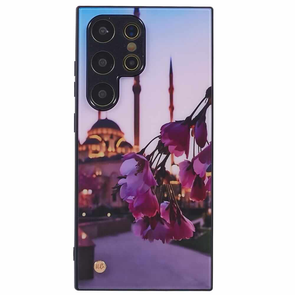 A smartphone case with a design featuring rose petals in the foreground and a mosque with multiple minarets in the background, set against a twilight sky.