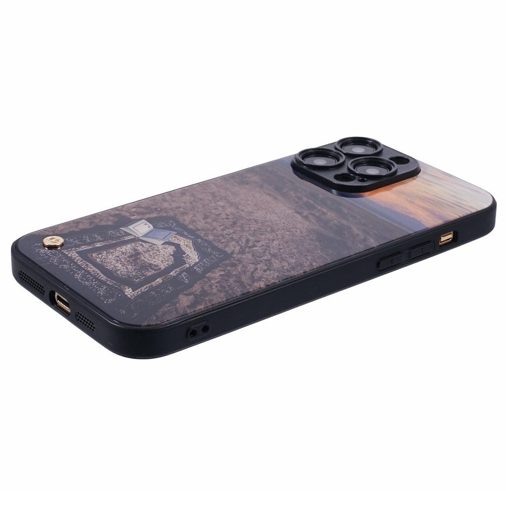 Islamic phone case featuring a prayer mat on the ground with a peaceful outdoor scene at sunset.