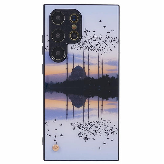 A smartphone case depicting a scenic view of a mosque with tall minarets at sunset. Numerous birds are flying in the sky, and the mosque is reflected in a body of water below, creating a symmetrical and tranquil composition.